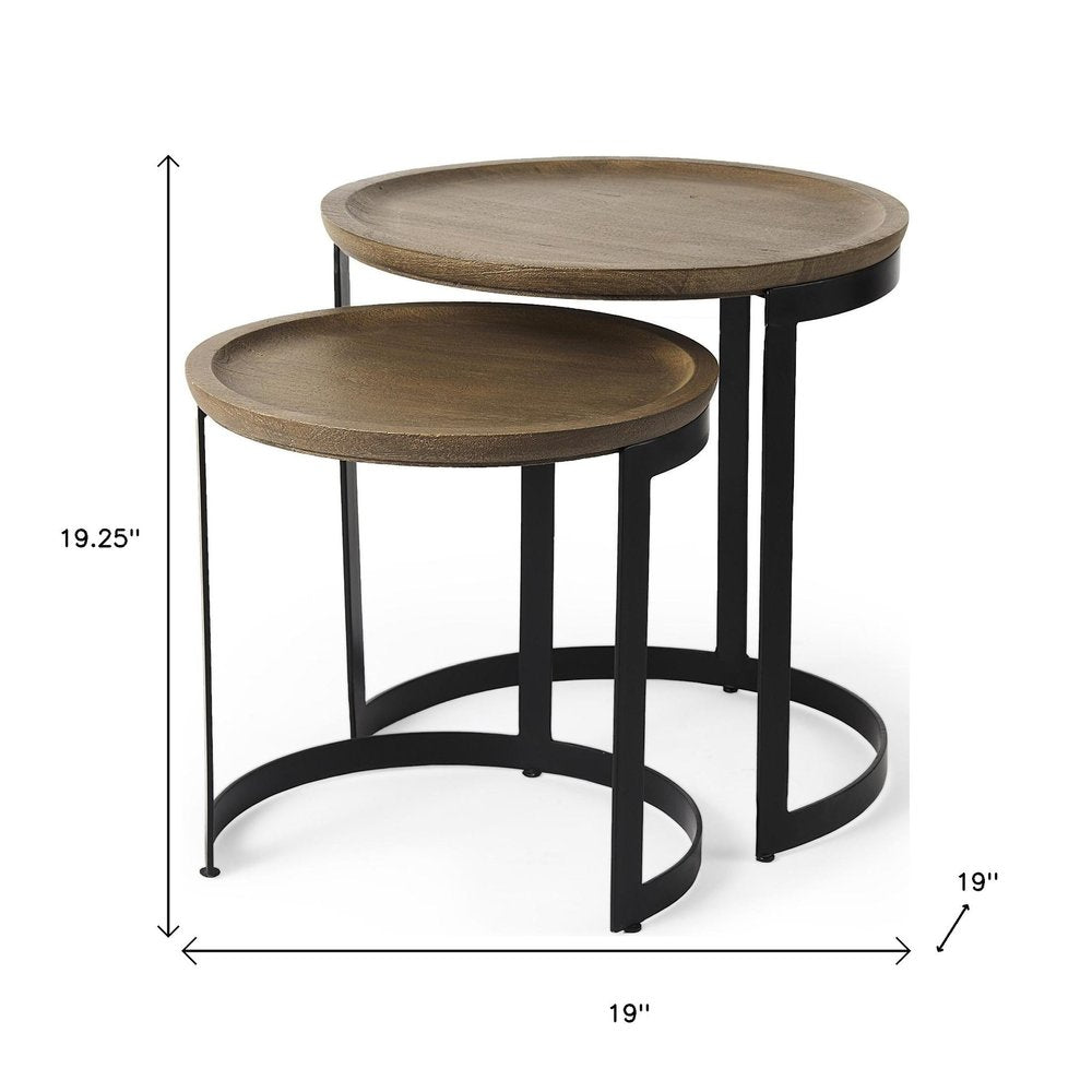 Set of Two Brown and Black Solid Wood and Iron Round Nested Tables on a white background