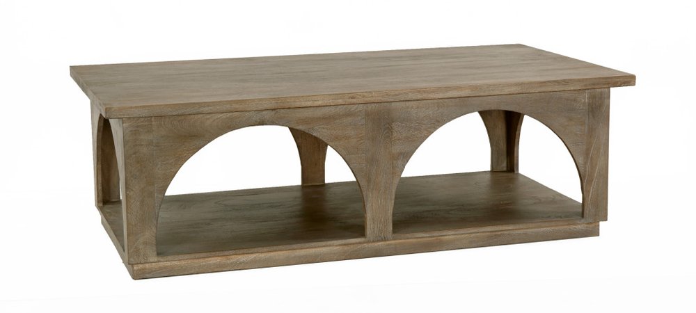 Brown solid wood distressed coffee table with a shelf and arched supports, on a white background.