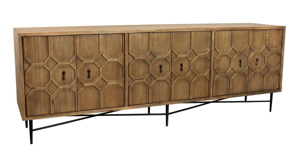 Natural distressed solid wood carved geometric sideboard with six doors on black metal legs against a white background.