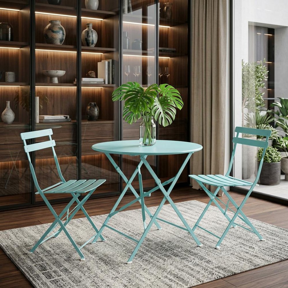 30" Aqua Rounded Aluminum Folding Outdoor Bistro Table with Umbrella Hole shown outdoors on a tiled patio in dark brown metal.