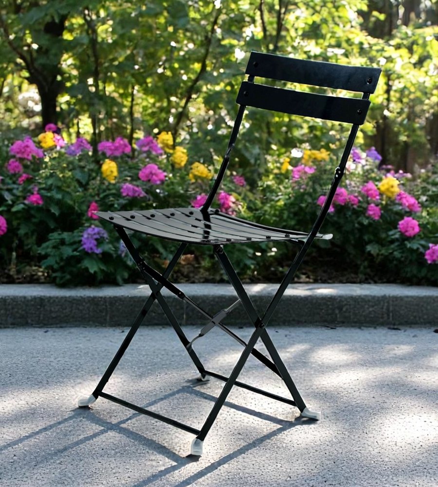 Set of Two Black Aluminum Outdoor Folding Dining Chairs in a home interior