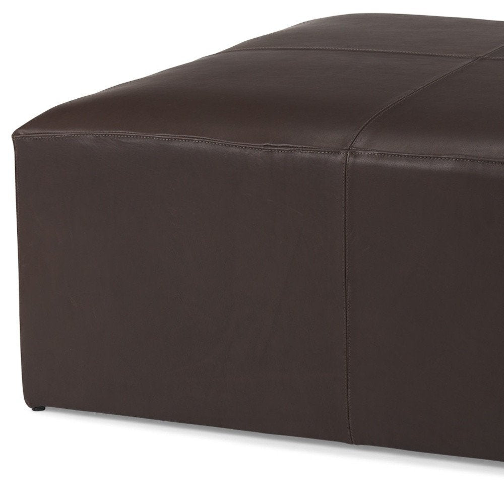 36" Brown Genuine Leather Cocktail Ottoman. Ottoman isolated on a plain white background, showing a leather surface.