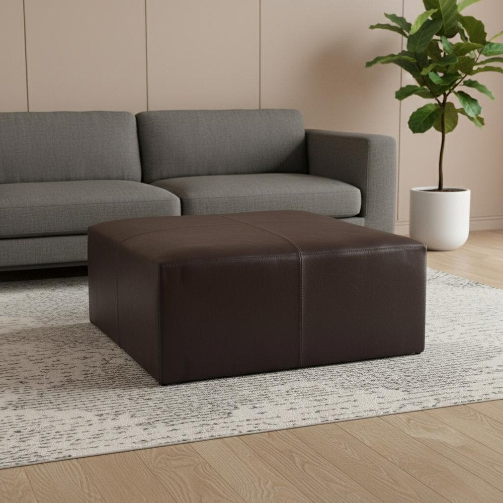 36" Brown Genuine Leather Cocktail Ottoman. Ottoman in brown leather.