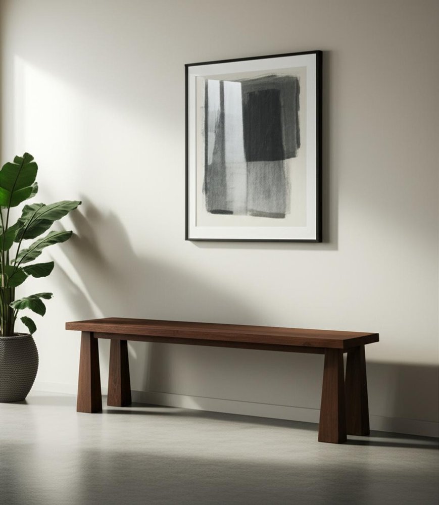 60" Dark Brown Solid Wood Bench styled in a furnished interior with a light gray wall on a charcoal floor.