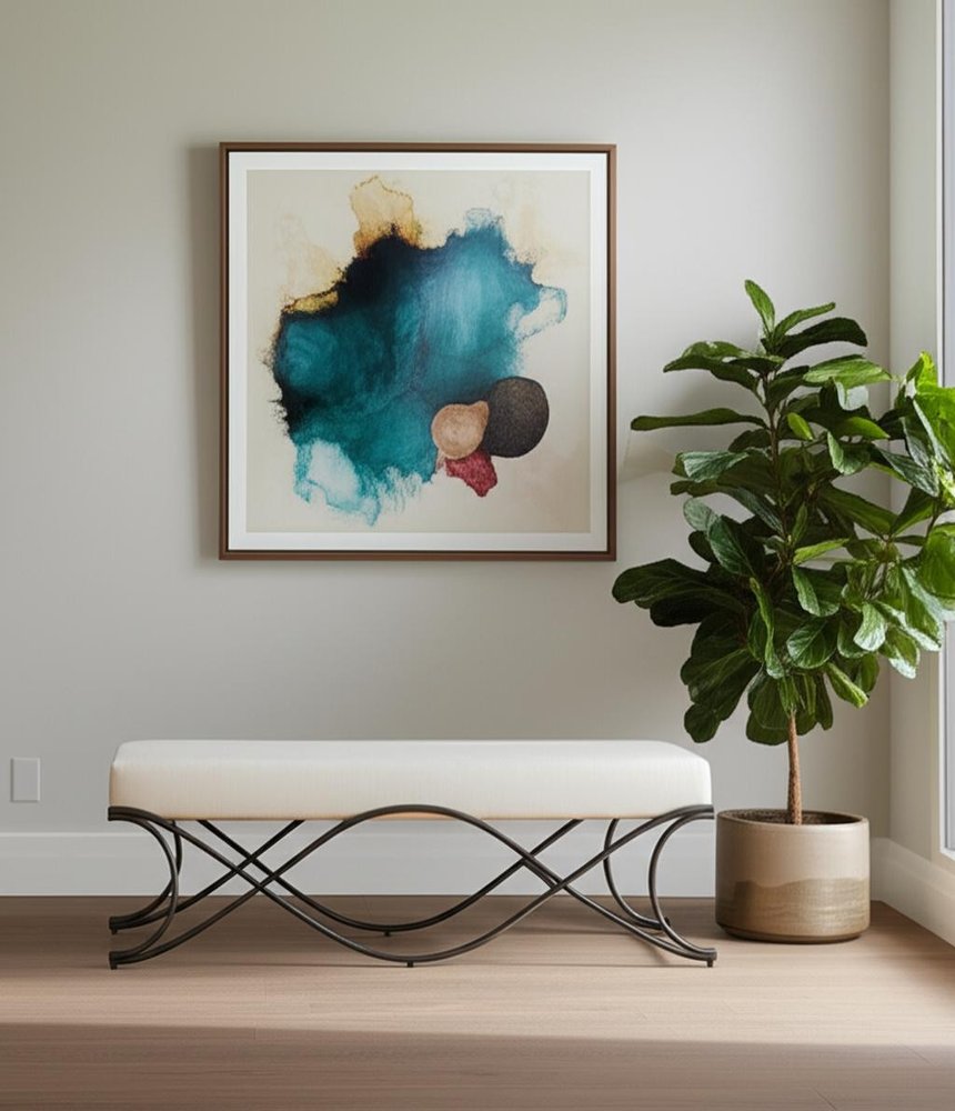 55" Cream and Nickel Fabric and Metal Upholstered Bench styled in a furnished interior with a light gray wall on a wood floor.