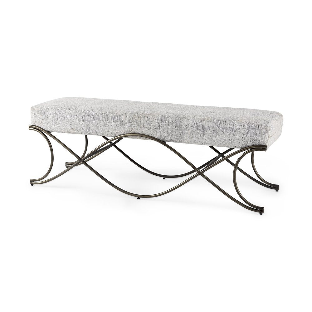 Bench with light gray chenille upholstery and dark metal scrolled legs on a white background.