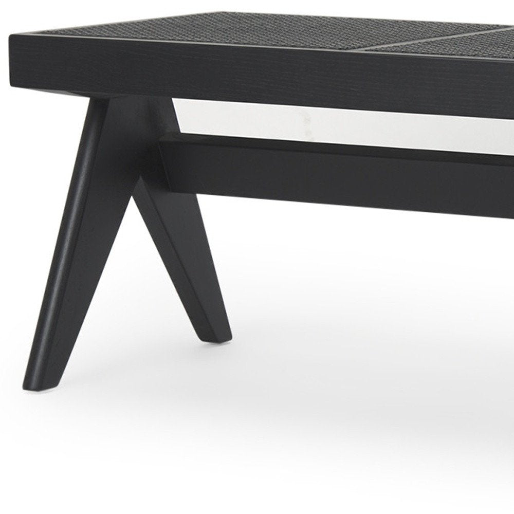 59" Black Solid Wood and Cane Dining Bench. Bench isolated on a plain white background, showing a black wood surface.