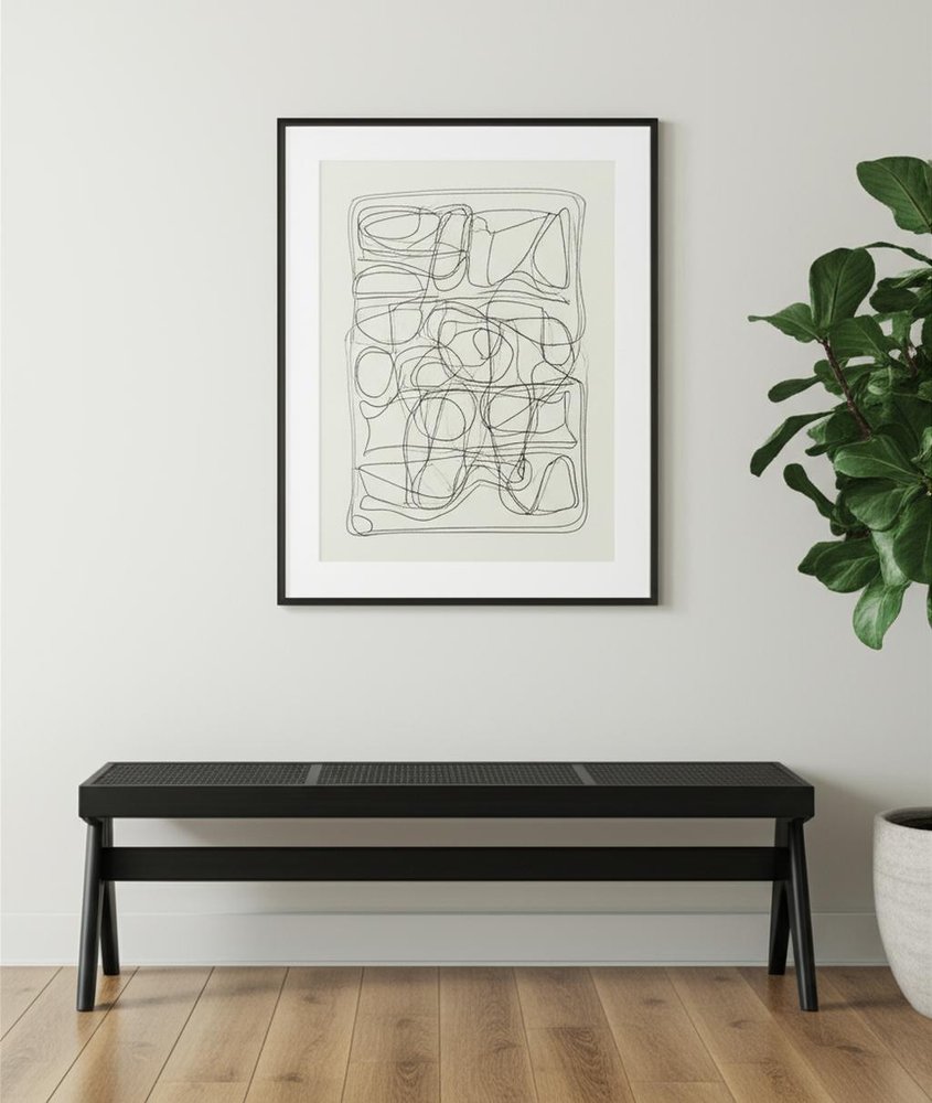 59" Black Solid Wood and Cane Dining Bench styled in a furnished interior with an off-white wall on a wood floor.
