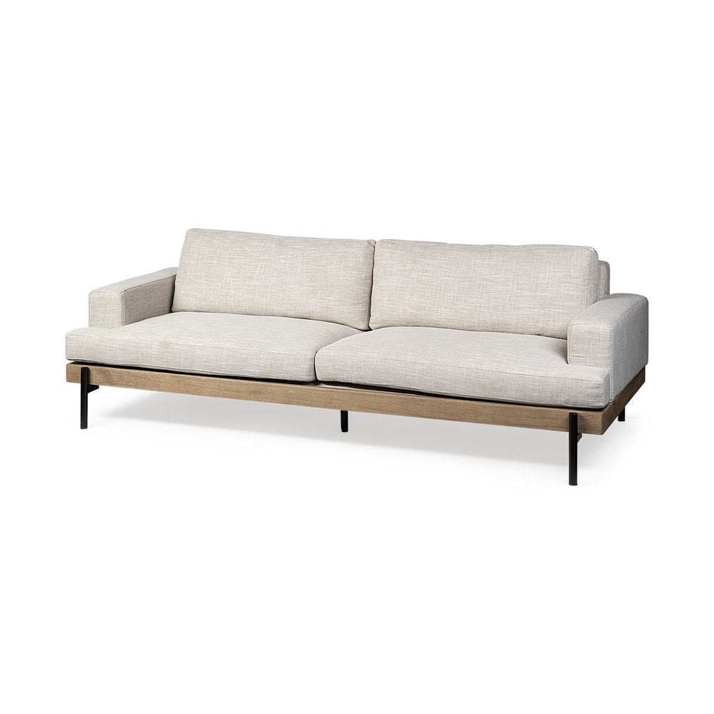 Beige fabric sofa with a light wood frame and black legs on a white background.