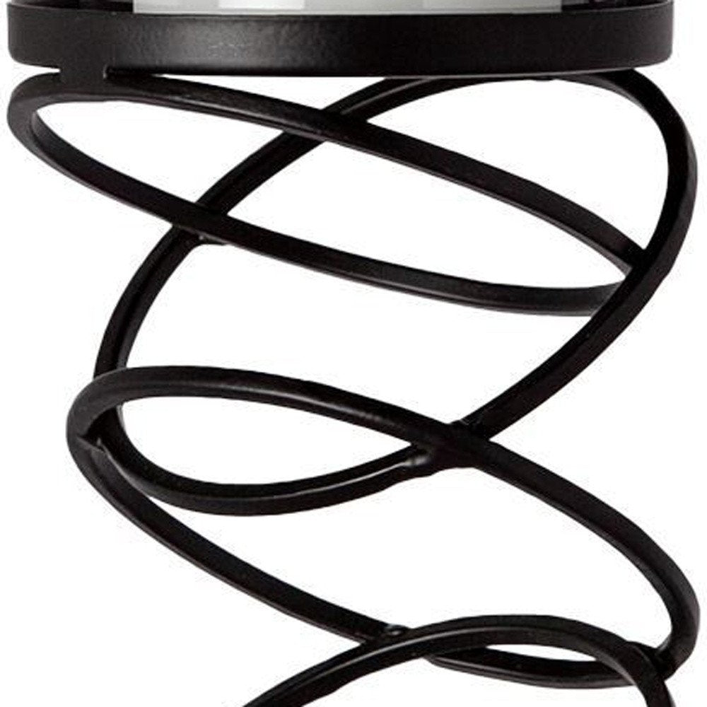 17" Black Geometric Glass And Metal Tabletop Pillar Candle Holder. Candle holder isolated on a plain white background, showing a black glass surface.