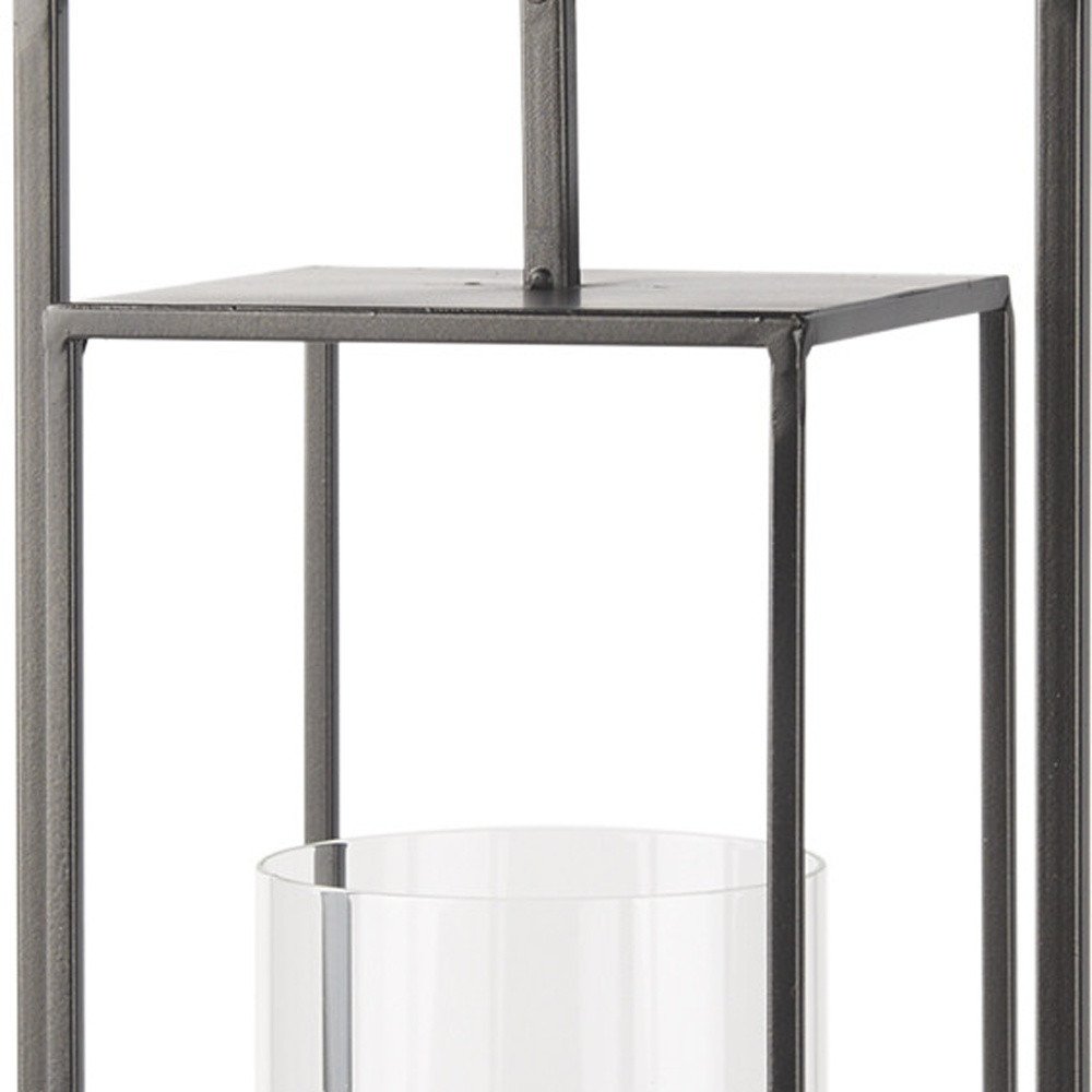 24" Black Geometric Metal Tabletop Lantern Candle Holder. Candle holder isolated on a plain white background, showing a black metal surface.
