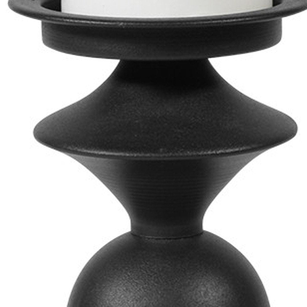 13" Black Metal Tabletop Pillar Candle Holder. Candle holder isolated on a plain white background, finished in black metal.