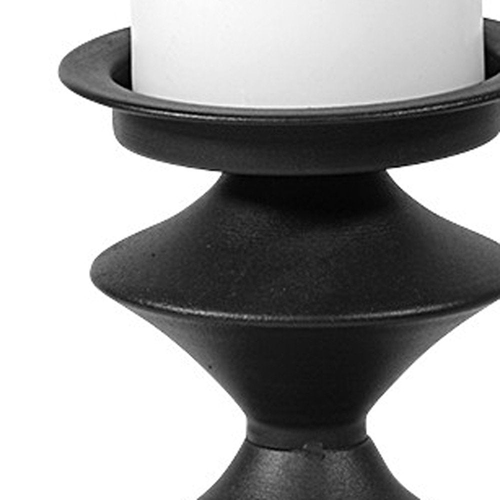 16" Black Metal Tabletop Pillar Candle Holder. Candle holder isolated on a plain white background, in a black metal finish.