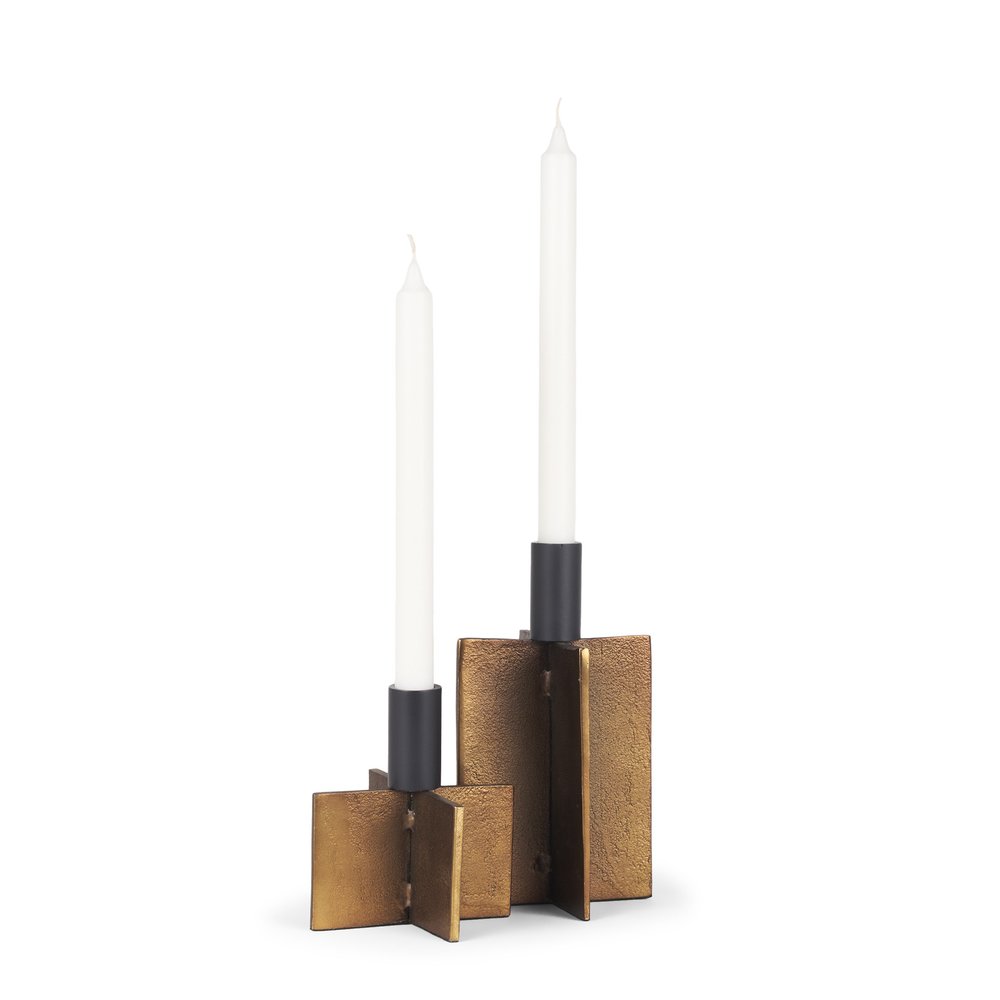 Two taper candle holders in antiqued gold distressed metal with black accents on a white background.