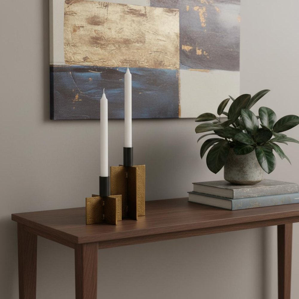 Set of Two Black And Antiqued Gold Distressed Geometric Metal Tabletop Taper Candle Holders in a home interior