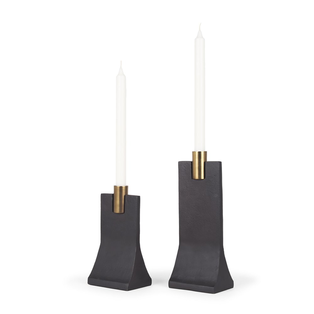 Two black taper candle holders with gold accents on a white background.