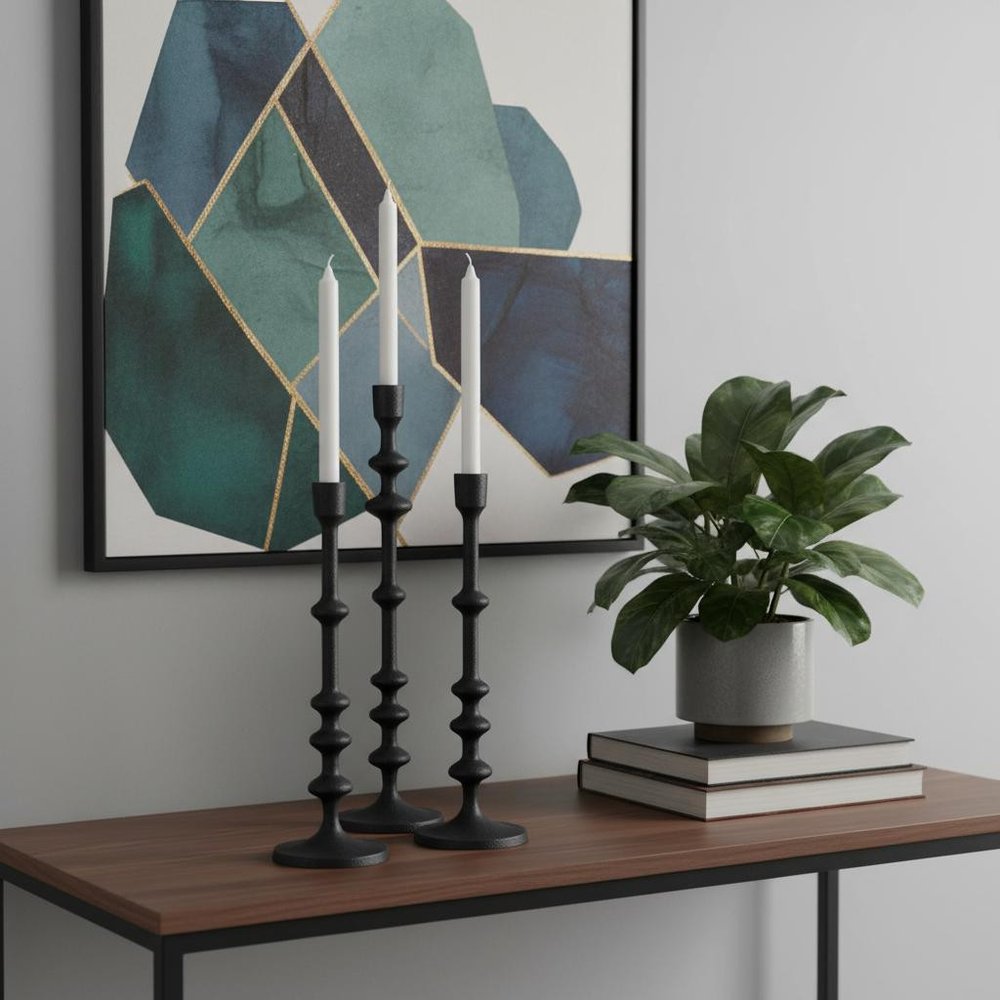 Set of Three Black Geometric Metal Tabletop Taper Candlesticks in a home interior