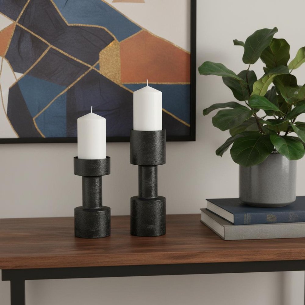 Set of Two Black Distressed Metal Tabletop Pillar Candle Holders in a home interior
