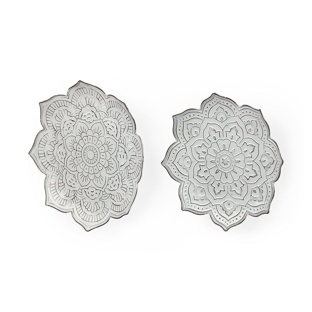 Two silver metal flower mandala sculptures on a white background.