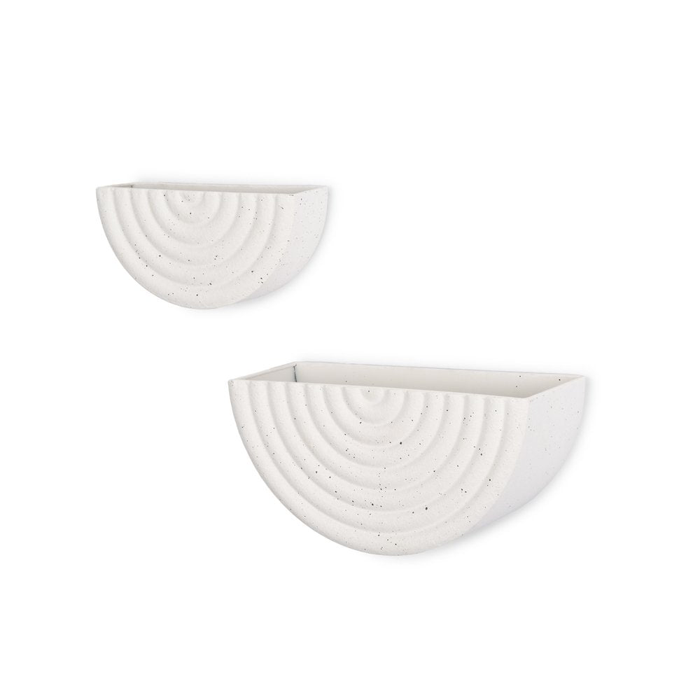Two white speckled metal half-moon wall planters with concentric curved designs on a white background.