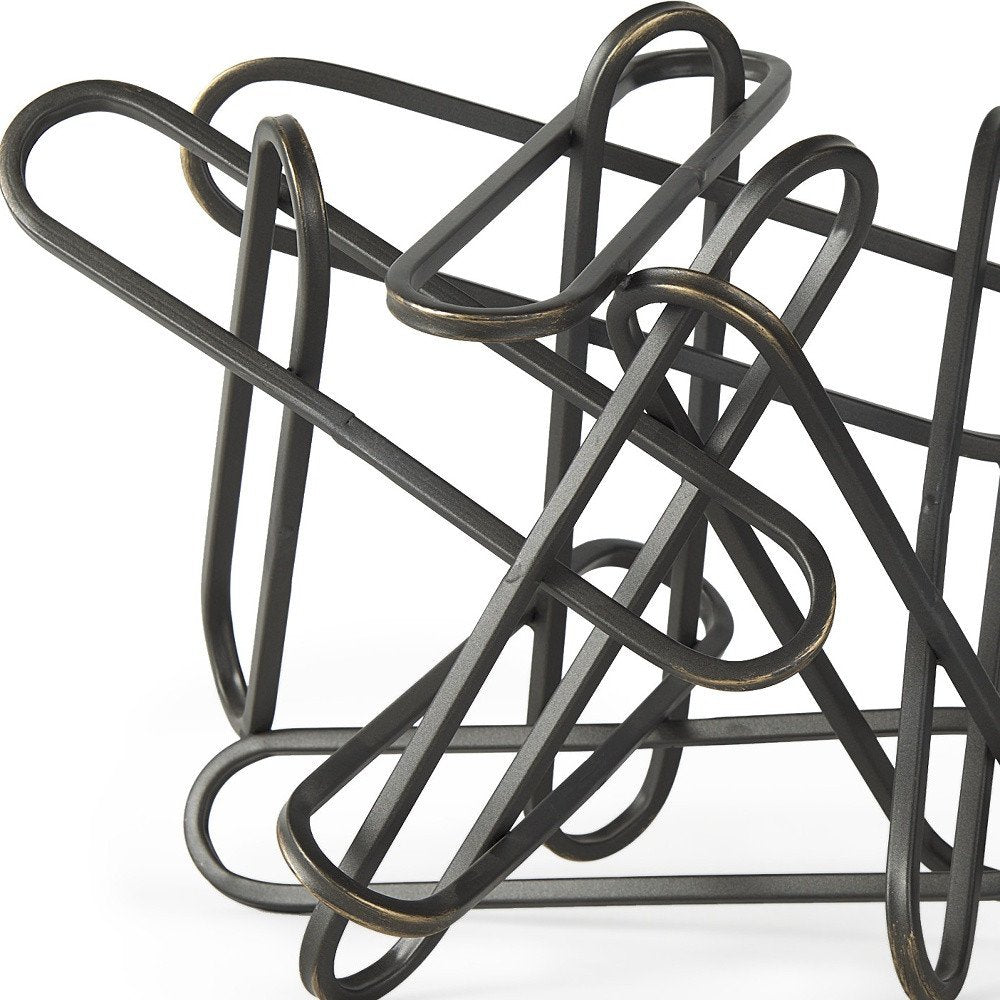 12" Black Metal Abstract Tabletop Sculpture. Sculpture isolated on a plain white background, showing a black metal surface.