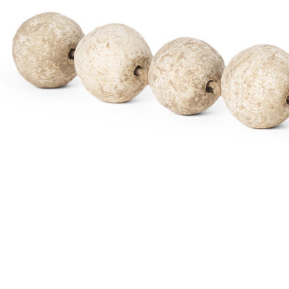 3" Beige Paper Sphere Tabletop Sculpture. Sculpture isolated on a plain white background, showing its beige color.