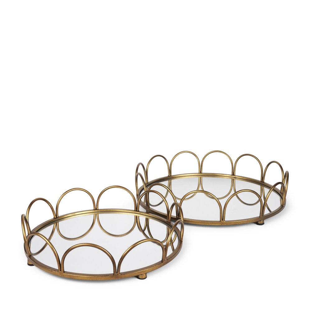Two antiqued gold metal and mirrored glass round vanity trays on a white background.
