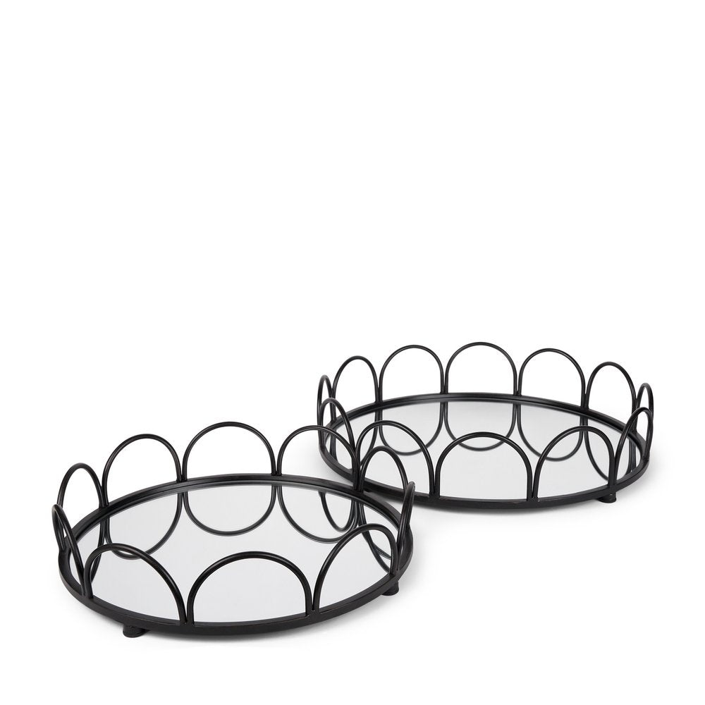 Two black metal and mirrored glass round vanity trays with scalloped edges on a white background.