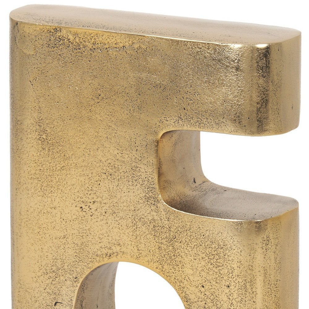 10" Brass Aluminum Tabletop Sculpture. Sculpture isolated on a plain white background, showing a metal surface.