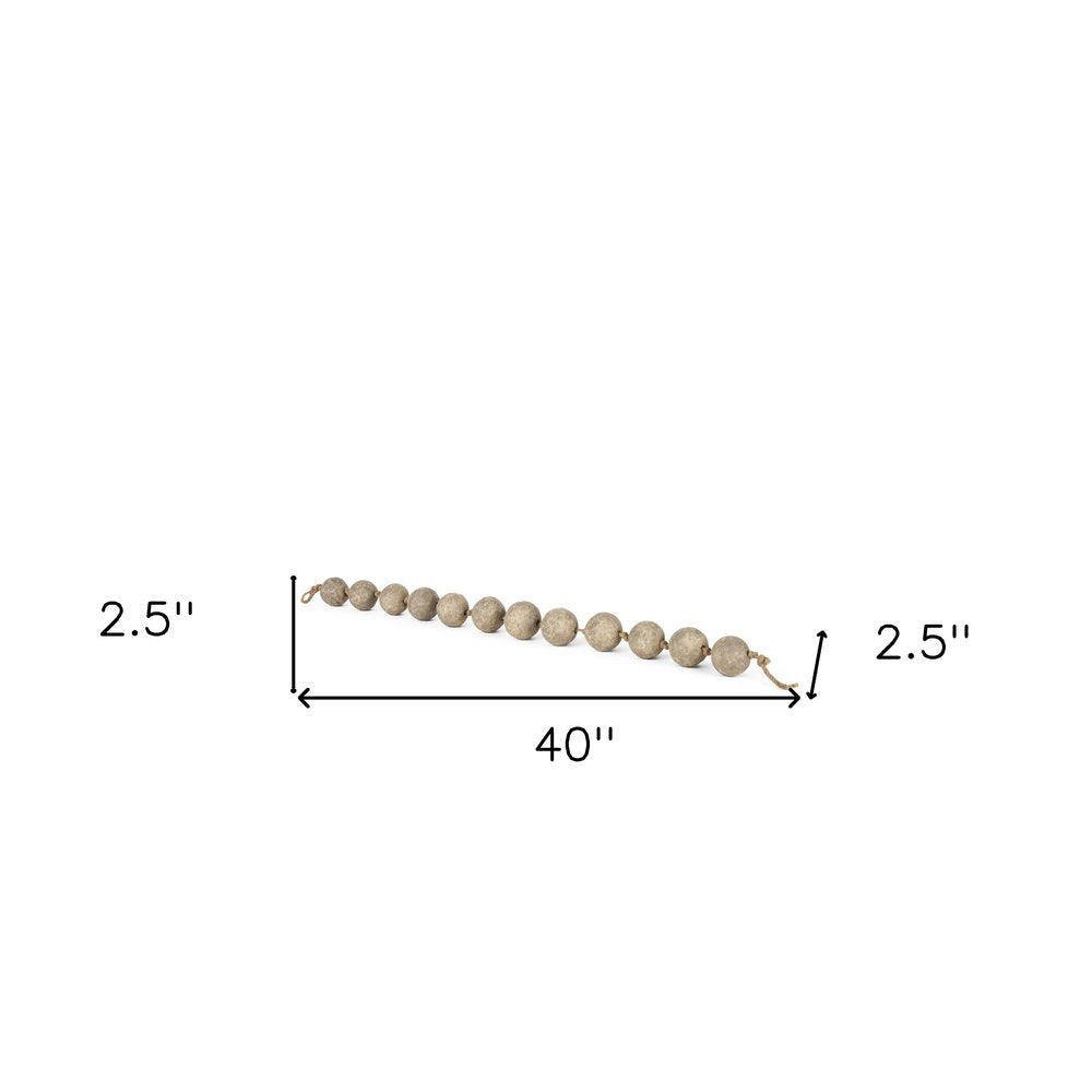 3" Beige Paper Sphere Tabletop Sculpture. Sculpture isolated on a plain white background, showing its beige color.