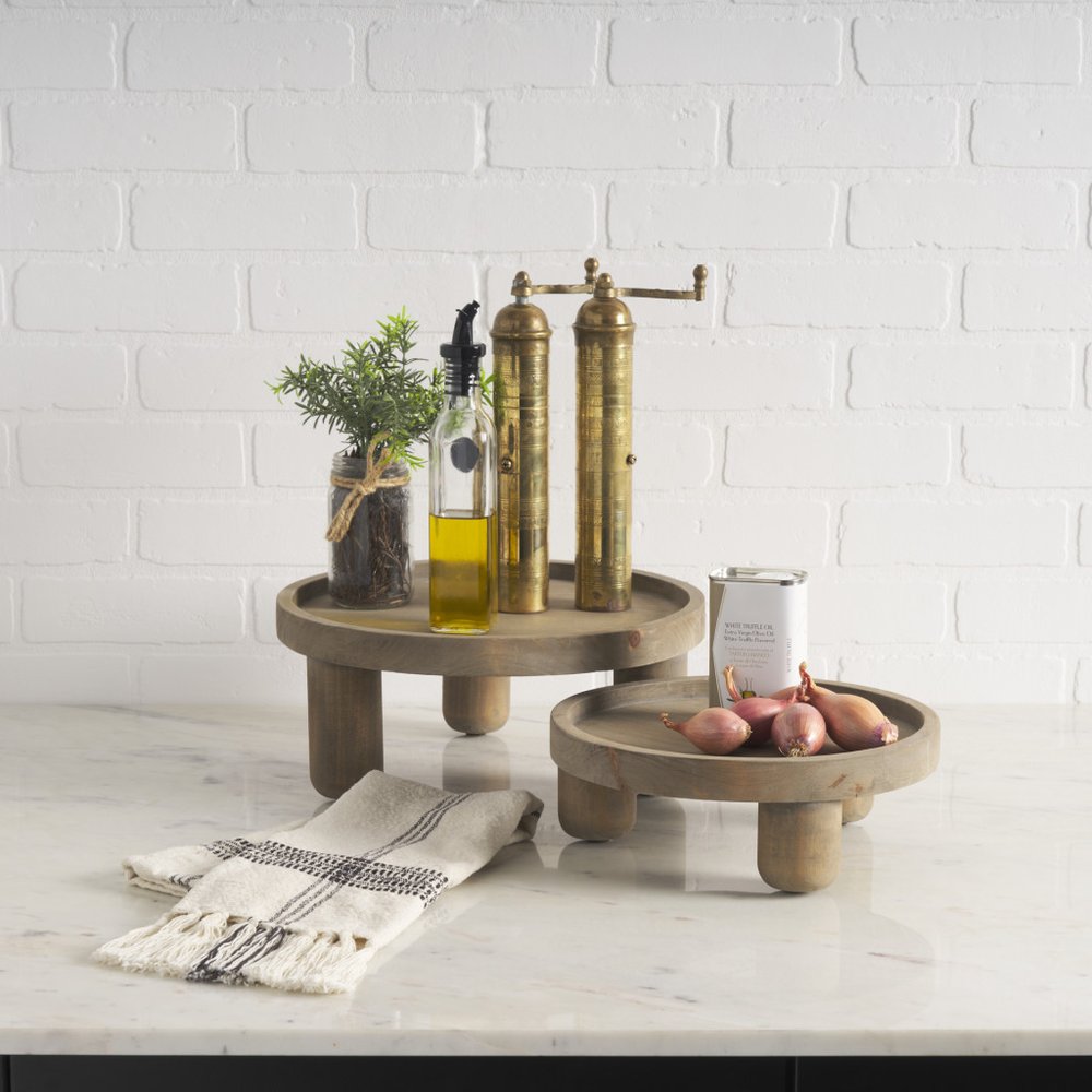 Set of Two Gray And Natural Solid Wood Handmade Round Risers in a home interior