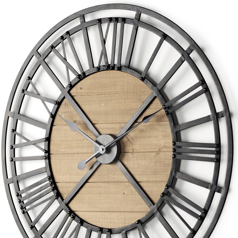 30" Black And Natural Iron And Wood Analog Round Wall Clock. Wall clock isolated on a plain white background, finished in black metal.