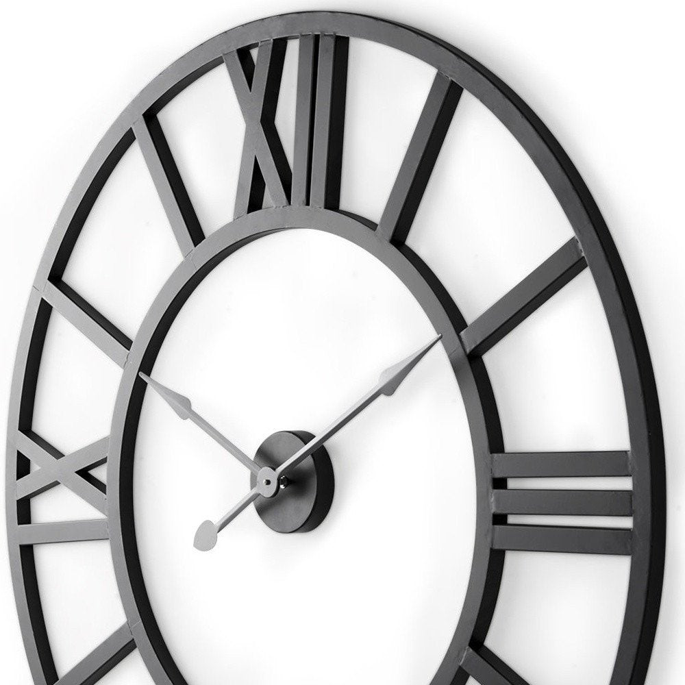 30" Black Iron Analog Round Wall Clock. Wall clock isolated on a plain white background, finished in black metal.