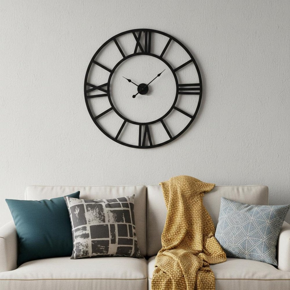 42" Black Iron Analog Round Wall Clock. Wall clock isolated on a plain white background, showing a metal surface.
