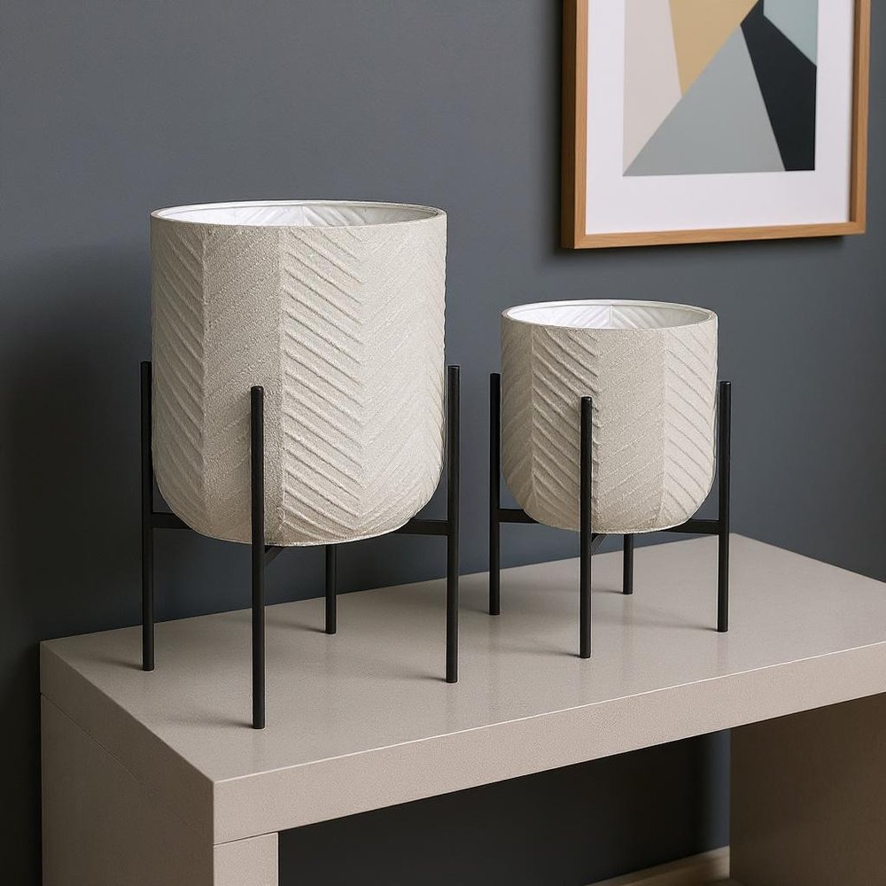 Set of Two Black Metal 20 Ounce Round Pot Planters - 24.8" H x 15.35" W x 15.35" D in a home interior