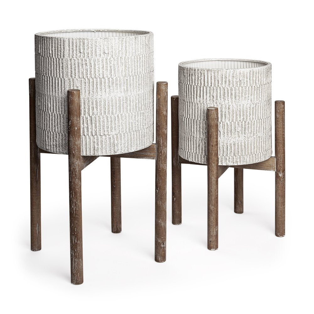Two cream ceramic planters with textured finish on brown wood stands against a white background.