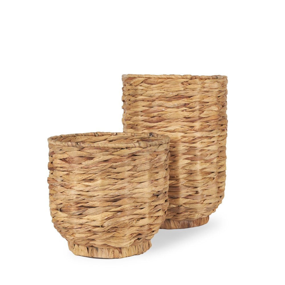 Two nesting woven water hyacinth baskets in natural brown tones on a white background.
