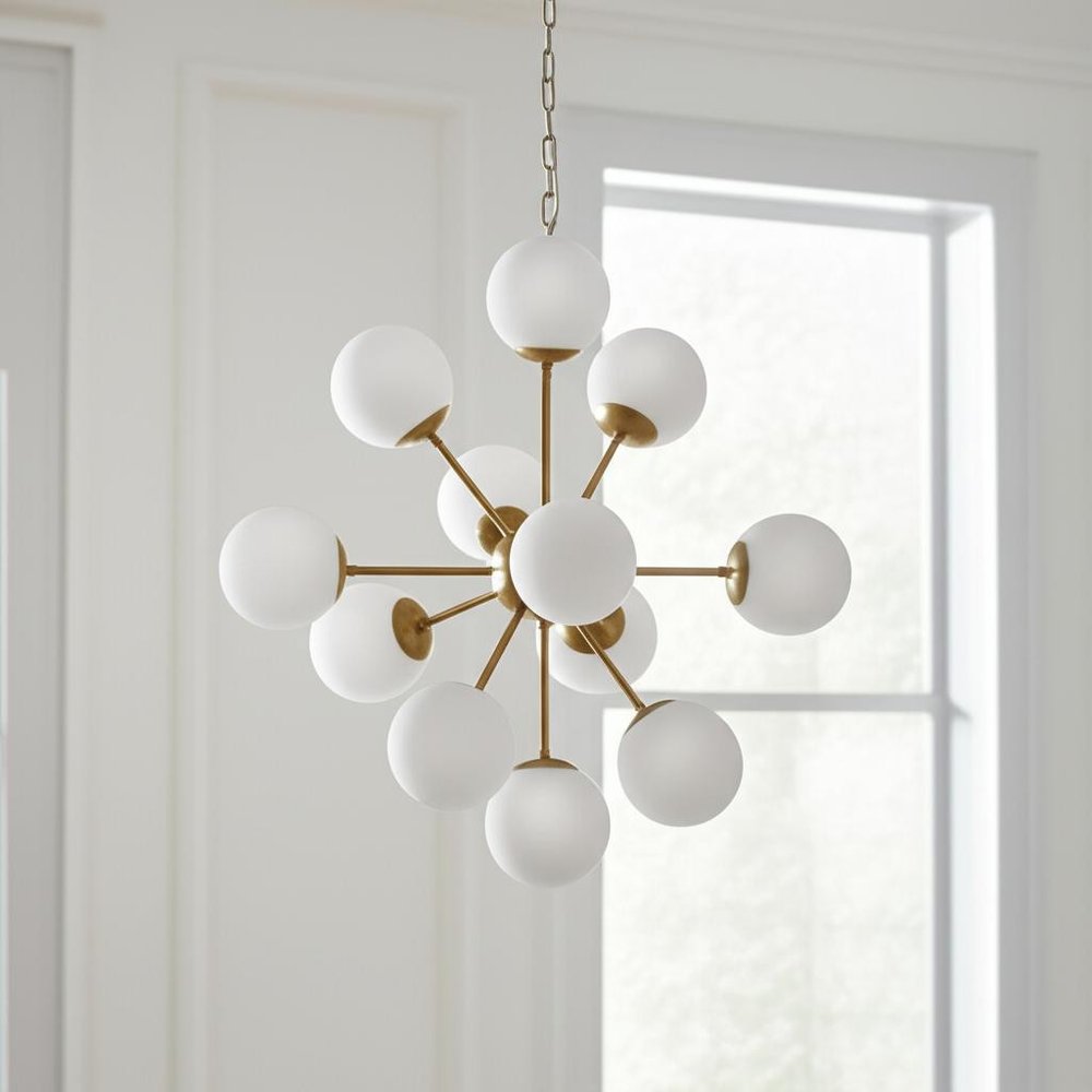 Gold Sputnik Eleven Light Frosted Metal and Glass Dimmable Chandelier With White Shades on a white background