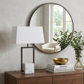 26" Gray Square Bedside Lamp With Shade styled in a furnished interior with a light gray wall on a dark wood floor.