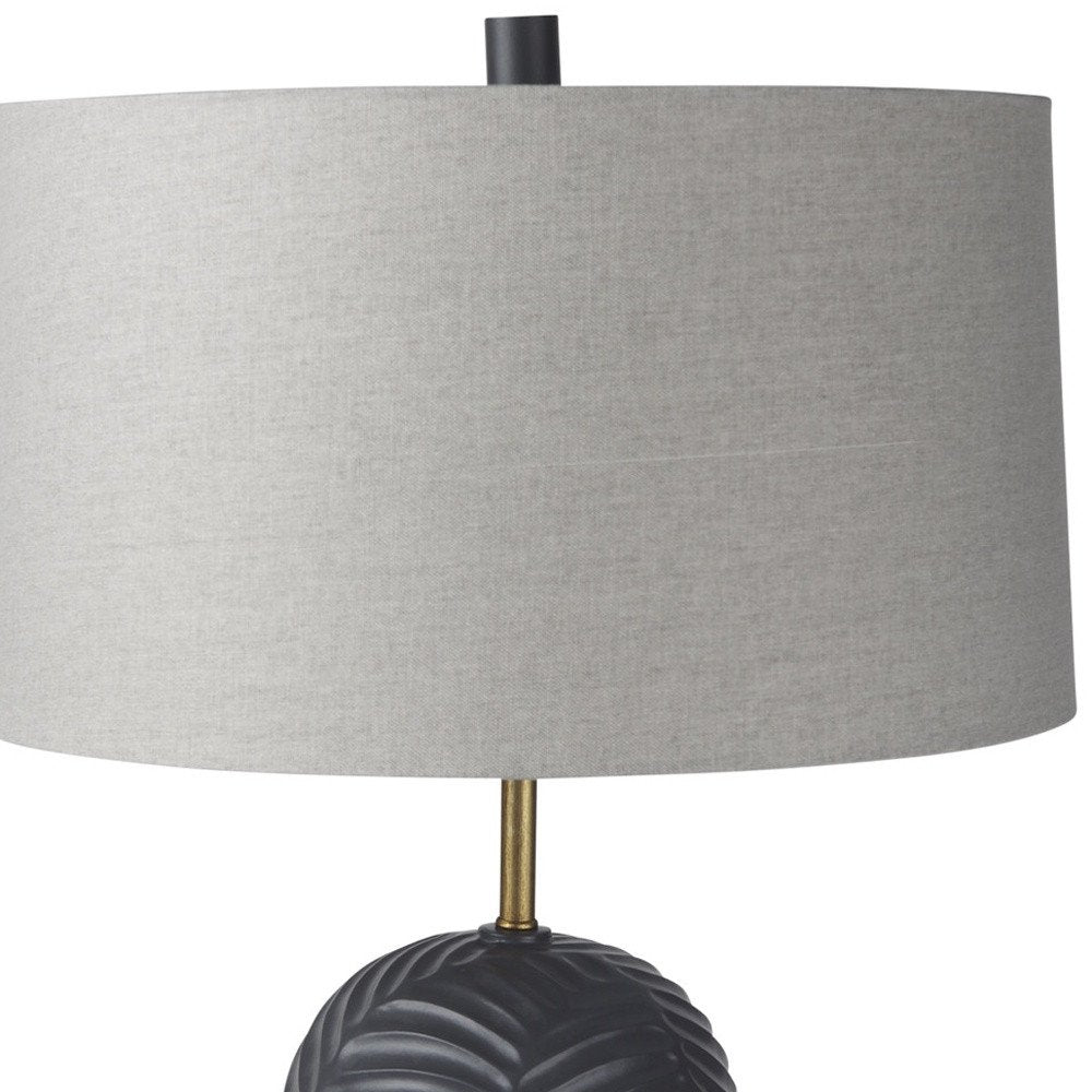 29" Navy Blue Round Bedside Lamp With Drum Shade. Lamp isolated on a plain white background.