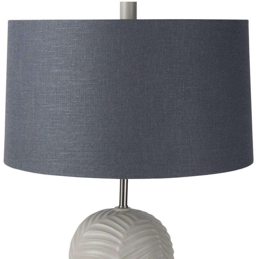29" Beige Round Bedside Lamp With Drum Shade. Lamp isolated on a plain white background.