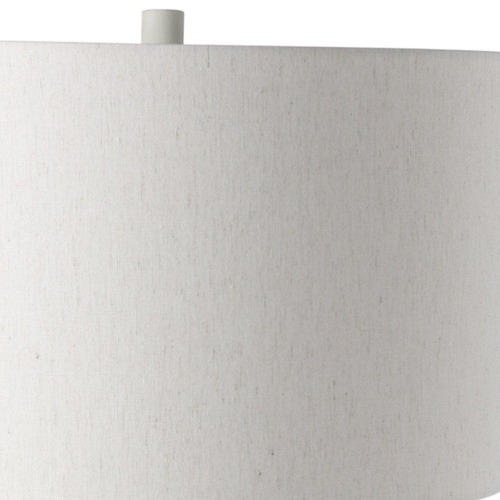 Cropped view of 30" Cream Round Bedside Lamp With Drum Shade focusing on the cream surface.