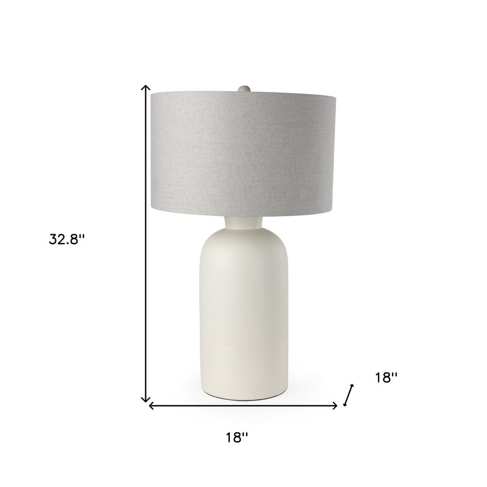 33" Cream Round Bedside Lamp With Drum Shade. Lamp isolated on a plain white background, in a cream finish.