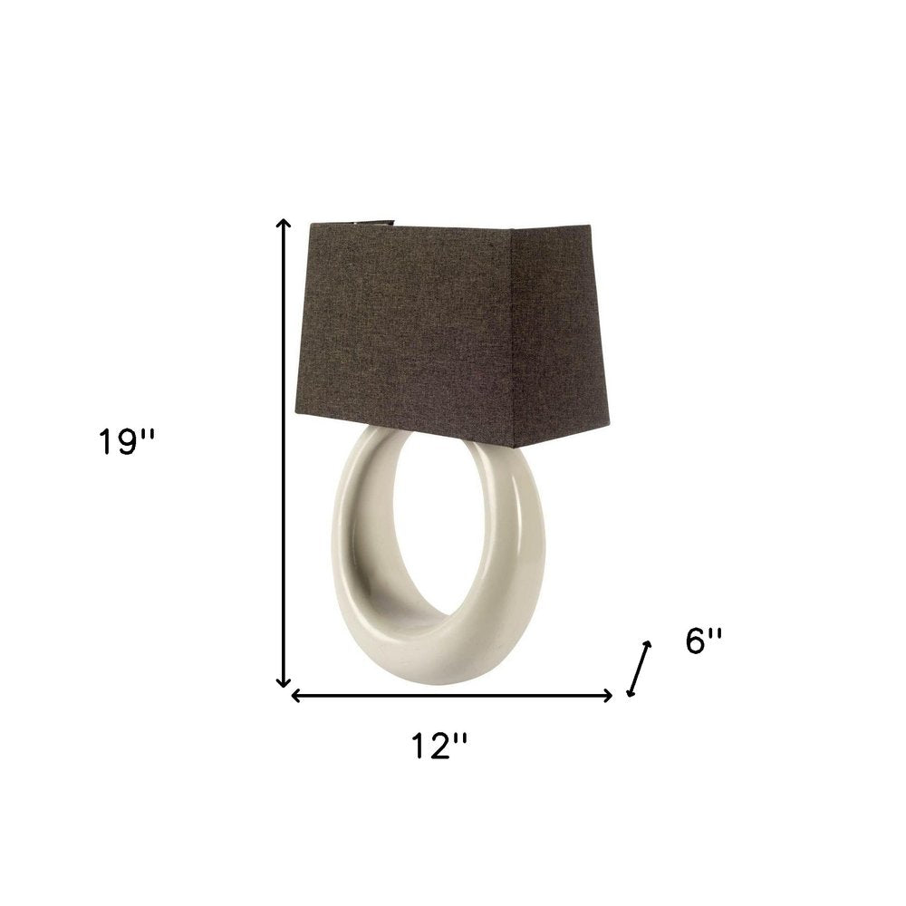 12" Dark Gray And Light Gray Resin and Fabric Armed Sconce. Wall sconce isolated on a plain white background, finished in charcoal resin.