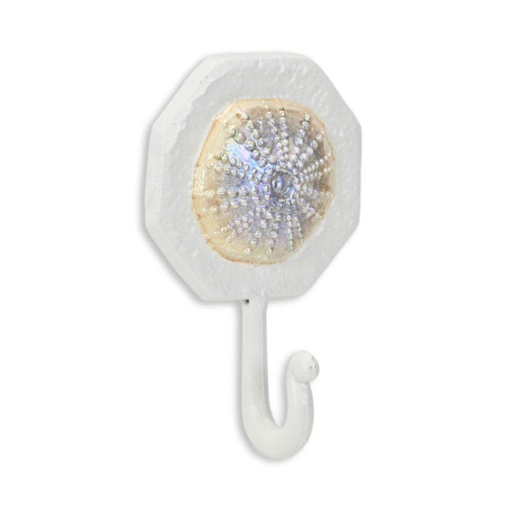 4" Pearl And White Cast Iron Sand Dollar Wall Hook. Coat hanger isolated on a plain white background, finished in white metal.