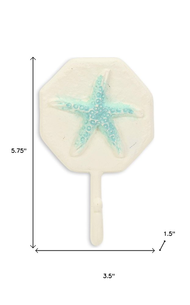 4" Aqua And Cream Cast Iron Starfish Wall Hook. Coat hanger isolated on a plain white background, finished in cream metal.