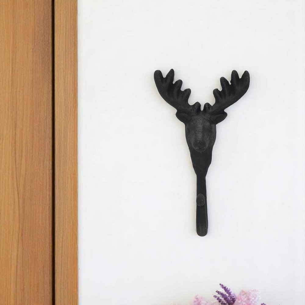 3" Black Cast Iron Deer Stag Wall Hook. Coat hanger isolated on a plain white background, showing a black metal surface.
