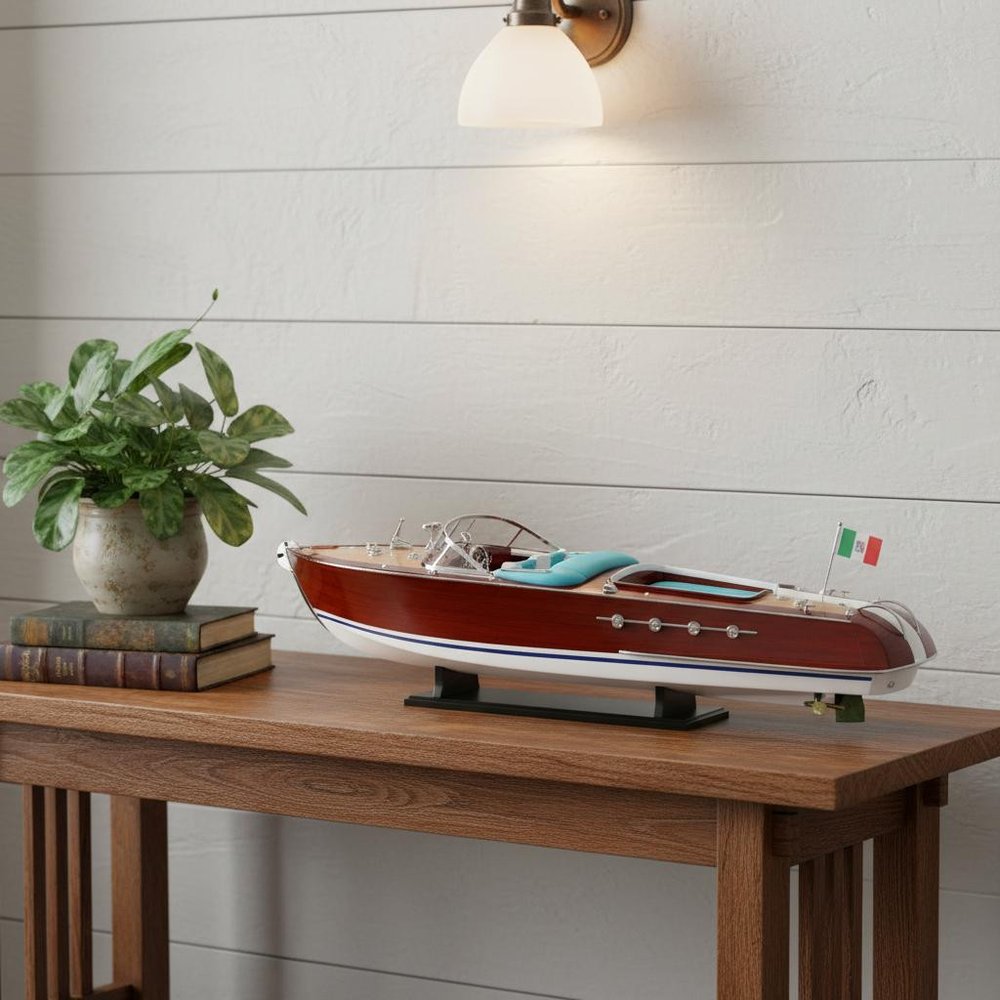10" Unfinished Wood Hand Painted Model Boat styled in a furnished interior with a light gray wall on a tiled floor in light gray wood.