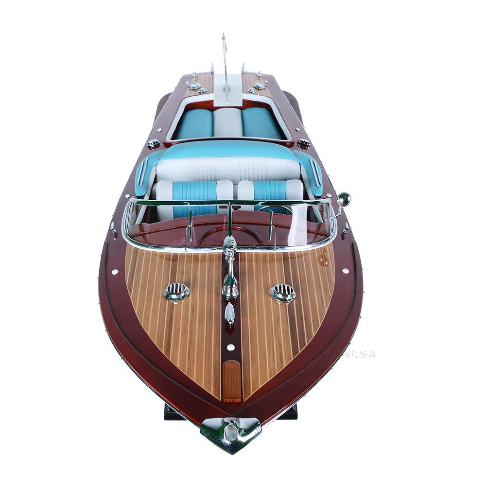 10" Unfinished Wood Hand Painted Model Boat. Home product isolated on a plain white background, showing a burgundy wood surface.