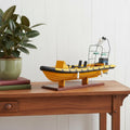 Close-up of 13" Unfinished Wood Hand Painted Model Boat showing dark brown wood detail.